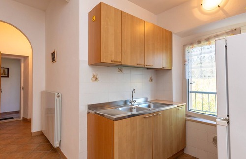 Rosignano Marittimo Apartment | Apartment 'Malva' with Shared Pool and Garden