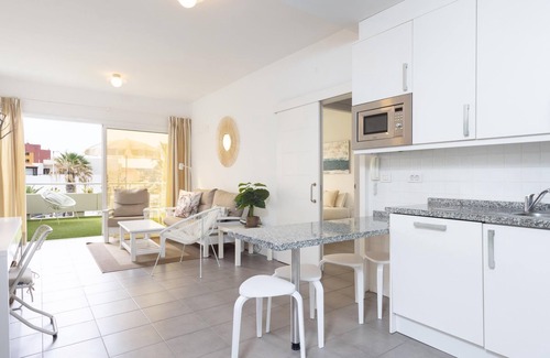 Poris de Abona Apartment | Apartment on the beach, work area and private parking - PillowAbroad