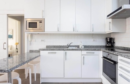 Poris de Abona Apartment | Apartment on the beach, work area and private parking - PillowAbroad