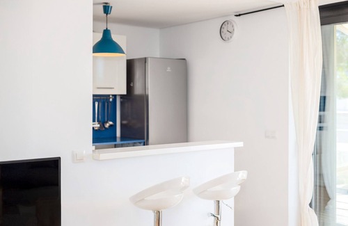 Cala Blanca Apartment | Apartment 'Sa Perdiu 24' with Sea View, Shared Pool and Air Conditioning