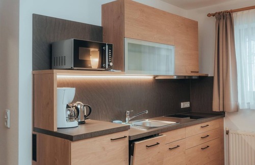 Hinterstoder House | Apartment - Terrasse, Bergblick 40m² - Frühstück - Landhotel Gressenbauer