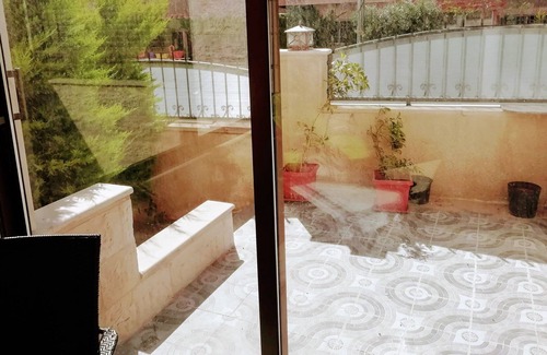 Amman Apartment | Apartment with a private terrace garden & garage