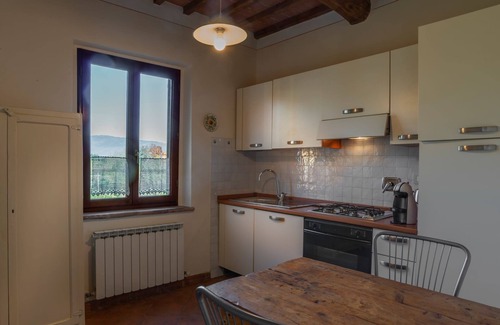 Laterina Apartment | Apartment with private terrace and panoramic views of pool, garden and Florentine mountains!