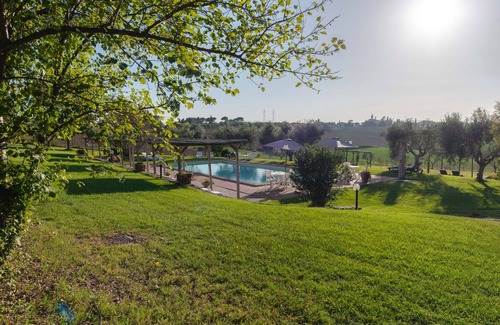 Badia Apartment | Apt. Pino with private garden, pool view and wonderful panorama.