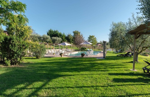 Badia Apartment | Apt. Pino with private garden, pool view and wonderful panorama.