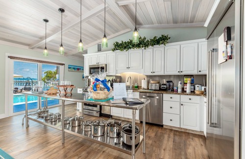 Stuart House | Aquatopia North: Riverfront beach house, w/dock, heated pool + hot tub & more!