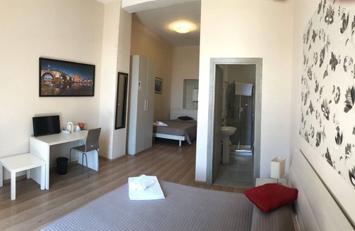 Esquilino Bed & Breakfast | Aria Rome Rooms triple room with balcony view of Basilica di San Giovanni