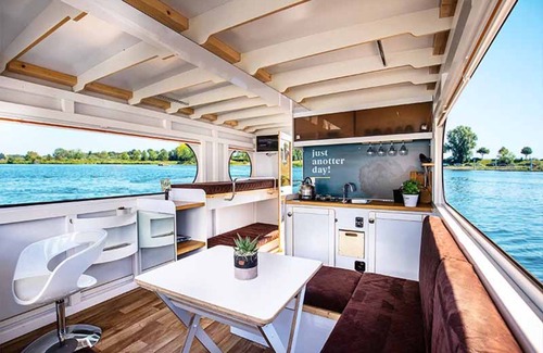 Ophoven Boat Rental | Attractive houseboat in Kinrooi with terrace