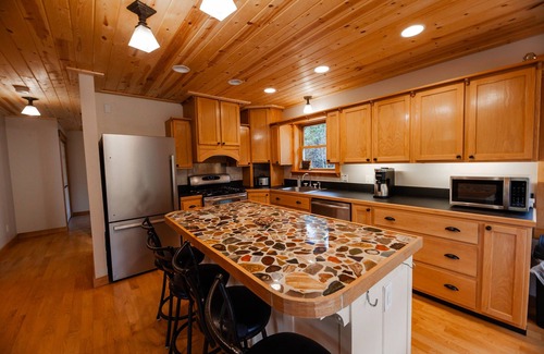 Champion House | ATV-Snowmobile Trail, Large home, sits on the peshekee river. sleeps 18 people.