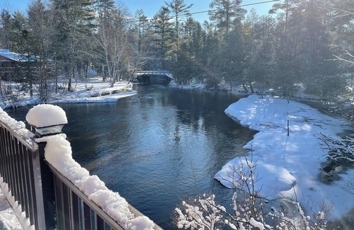 Grayling House | Ausable River waterfront 4-bed house in Grayling w/dock, patio, firepit, garage.
