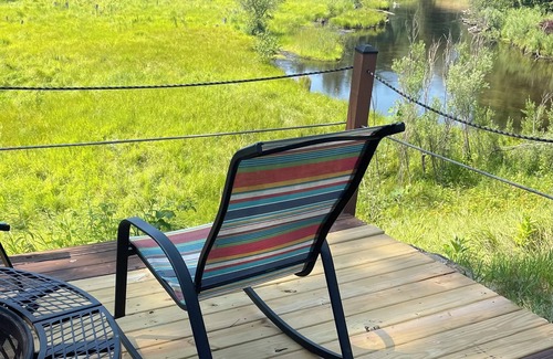 Grayling House | Ausable River waterfront 4-bed house in Grayling w/dock, patio, firepit, garage.