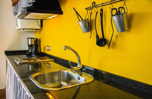 Haria House | B & BLolayJuan: Apartment kitchen, private bathroom and heated pool "LA TROJA"