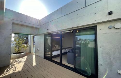 Hiroshima City Centre Apartment | b hotel Nekoyard - Scenic Penthouse Studio with Jacuzzi & Spacious Terrace