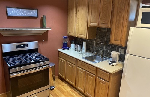 Lamar Heights Area Apartment | B. Spacious one-bedroom apartment in lower level with large windows