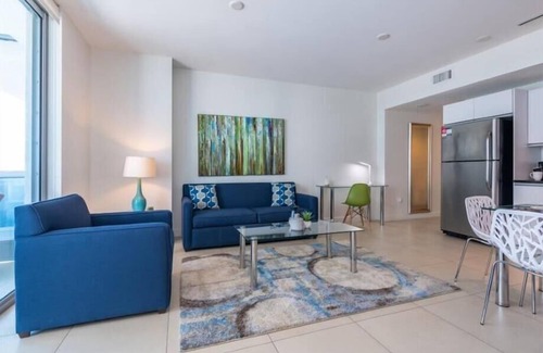 North Beach Apartment | Balcony w/Partial Ocean Views | Work Desk + Wi-Fi | Pool+ Hot Tub | Gym