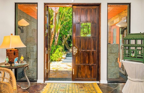 Parrot Cove House | Bali Inspired Home on Golf Course- 4 Bedroom + Heated Lagoon Pool!