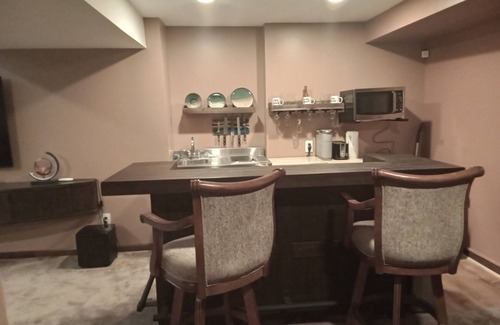 Lansing Apartment | Basement Apartment, Outdoor Hot Tub add on, infrared Sauna, Pool Table and more