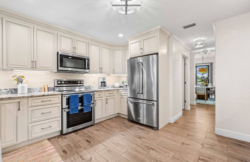 Bayshore Gardens House | Bayfront estate with heated pool, private beach, dock & incredible sunsets