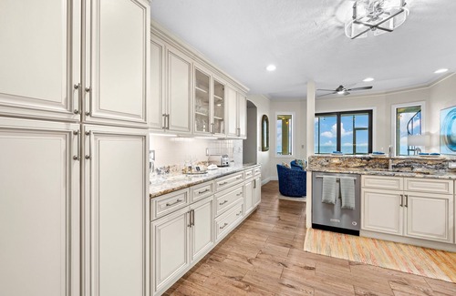 Bayshore Gardens House | Bayfront estate with heated pool, private beach, dock & incredible sunsets