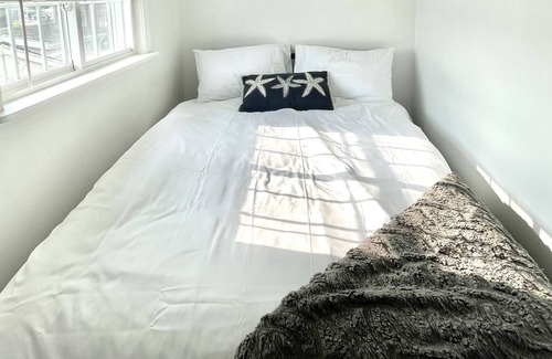 Buzzards Bay Cottage | Bayside studio cottage on Buttermilk Bay, steps to the private sandy beach.