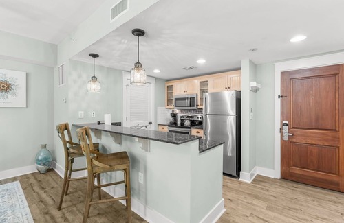 Baytowne Wharf Condo | Baytowne Wharf Condo with Walk Out Patio & Tram Service