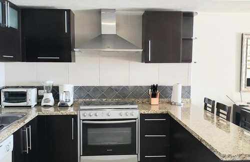 South Hotel Zone Condo | Beachfront 1 br. condo with private hot tub at Gran Venetian Puerto Vallarta