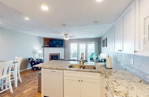 East End House | Beachfront East End townhouse with beach views, deck, on-site pool & grills