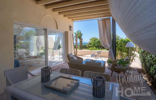 Nikki Beach Apartment | Beachfront Elviria II,Sea views, lovely terrace and pool