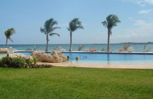 Puerto Aventuras Condo | Beachfront Location with 2 Pools; Private Terrace