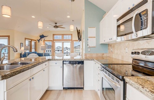 Buck Island House | Beachin Fun (North Unit) | 1665 ft to the beach | Hot Tub, Dog Friendly, and Community Pool