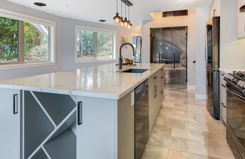Central Okanagan Condo | Beachside Bliss! Spacious Ground Level Walk Out Patio Direct on the Beach & Lake