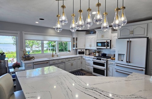 Oshkosh House | Beautiful 5 bedroom 3.5 bath EAA lakehouse.n with the most beautiful sunsets.