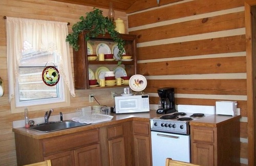 Beattyville Cabin | Beautiful, authentic log cabin with acres of land, fishing pond, and hot tub.