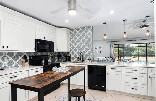 Rural Estates Villa | Beautiful Canal Front Home with Pool, Tennis Court