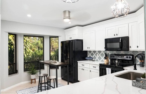 Rural Estates Villa | Beautiful Canal Front Home with Pool, Tennis Court