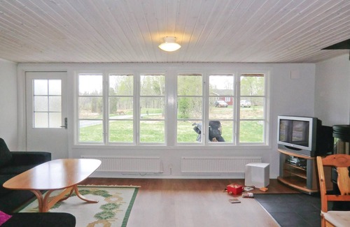 Vittsjo House | Beautiful cottage with fireplace for cool evenings.