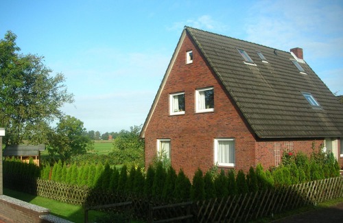 Dornum Apartment | Beautiful fine apartment with garden, meadow, view of water and land