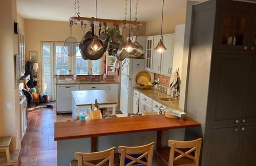 West Medford Apartment | Beautiful, family-friendly home with yard and patio near Tufts, 10 min to Boston