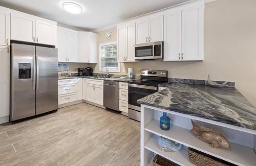 Siguenza Cove Cottage | Beautiful Fully Renovated Beach Cottage in the Purple Parrot Resort!