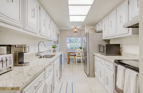 Juno Beach House | Beautiful home across street from beach path with AC, patio & washer/dryer