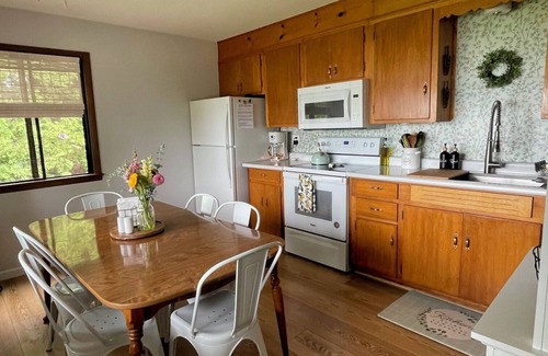 Traverse City Cottage | Beautiful lakefront cottage on South Lake Leelanau with pontoon!