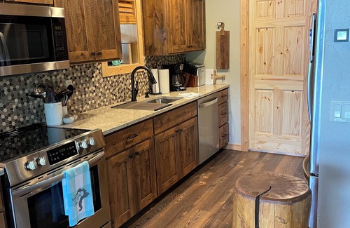 Sandpoint Cabin | Beautiful Log Cabin Getaway on Pend Orielle w/Private Dock, Hot Tub, Firepit