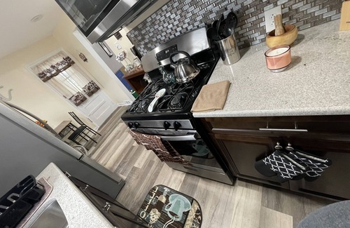 Sharon Hill House | Beautiful newly renovated home near airport with fireplace & sunroom.