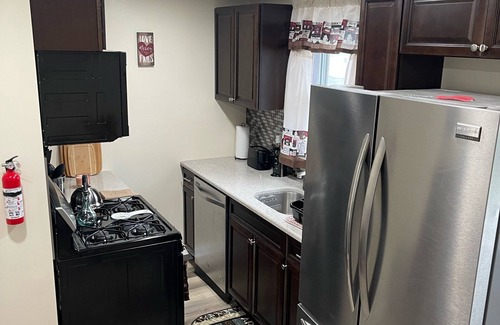 Sharon Hill House | Beautiful newly renovated home near airport with fireplace & sunroom.