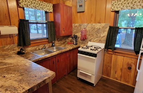 Arbor Vitae Cabin | Beautiful Northwoods Cabin with Large Deck, Dock, Community Firepit & kayaks