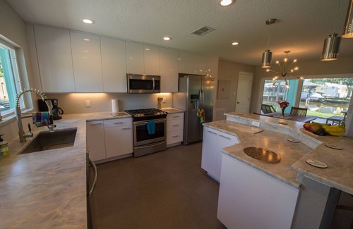 Convair Cove House | Beautiful renovated canal home w/dock, 4 blocks from beach &downtown Cocoa Beach