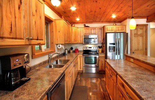 Eagle River House | Beautiful setting of charming house on Eagle River Chain of Lakes Catfish Lake