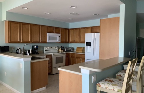 Catalina Isles House | Beautiful sunset and water view home in Crown Colony gated community.