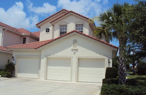 Catalina Isles House | Beautiful sunset and water view home in Crown Colony gated community.