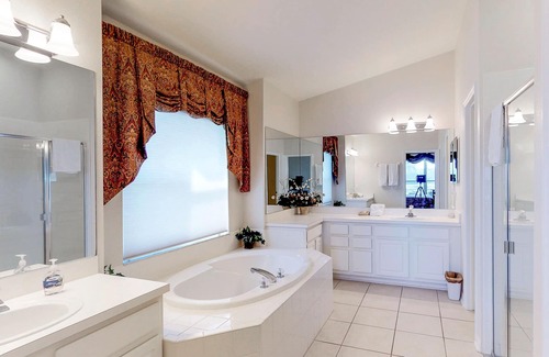 Sabal Harbour House | Beautiful Waterside Home with a Private Pool, Spa, and Lake Views